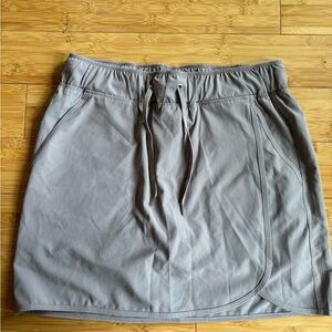 Tan/Nude Activewear skirt with attached shorts! Pockets too! Size medium